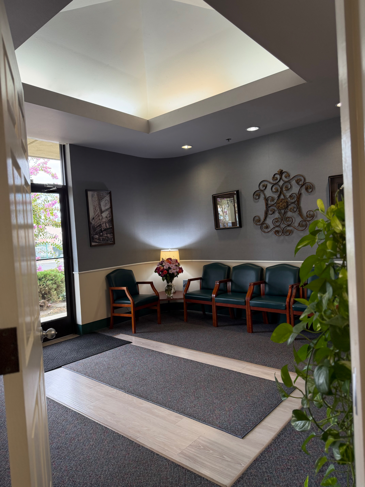 Comfortable lobby waiting area with seating and natural light